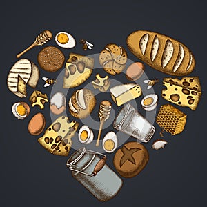 Heart floral design on dark background with milk, cheese, chicken, eggs, buns and bread, honey