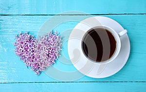 Heart of flowers lilac and a Cup black tea