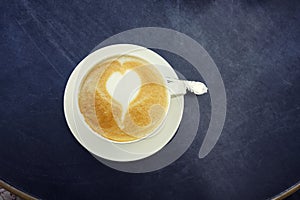 Heart foam latte coffee in white cup