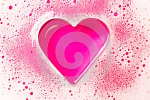 Heart from a foam on a pink background.