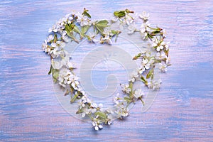 Heart Frame of Spring Flowers on the background of old vintage b