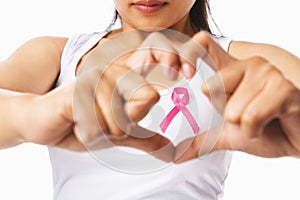 Heart framing on woman chest with pink badge