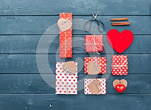 Heart and gift boxes over wooden background. Flat lay photo