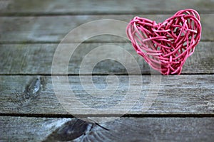 Heart on grey wooden plank