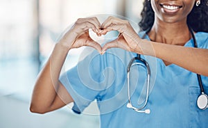 Heart hand and black woman nurse in hospital with expression to show love and care for career. Professional medical