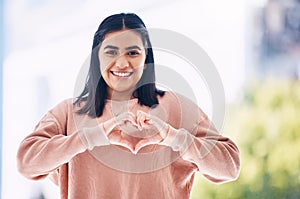 Heart hands, portrait and happy woman for self care, cardiology wellness and gen z support for women health. Face of a