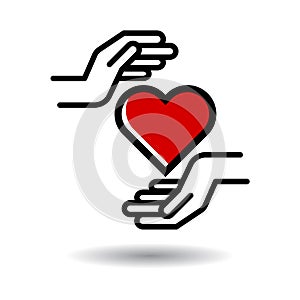 Heart in hands icon photo