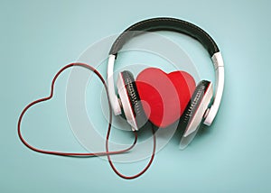 Heart with headphones and red heart-shaped clable.Romantic music concept