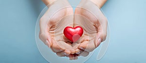 The heart held gently between two caring hands AI generated image