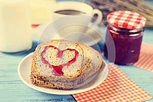 Heart of jam on a toast, with a cross-process effect