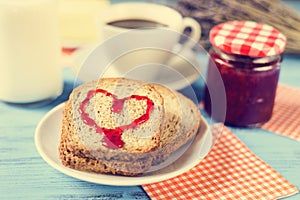Heart of jam on a toast, with a cross-process effect photo