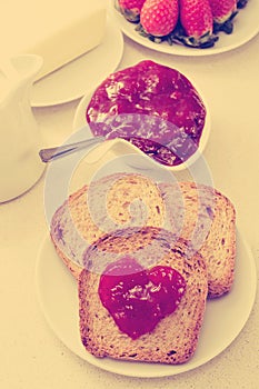 Heart of jam on a toast, filtered