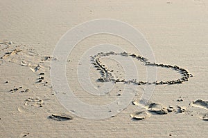 Heart of love drawn in the sand