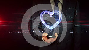 Heart love symbol on businessman hand