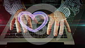 Heart love symbol with man typing on a computer keyboard