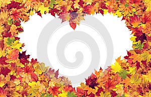 Heart made from autumn leaves isolated on white background