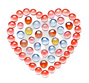 Heart made of colorful glass beads. Isolated on white background. Valentine`s day concept