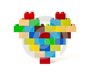 Heart made from colorful toy bricks with clipping path