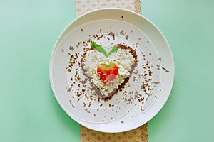 Heart made of curd and strawberry. Food art. Healthy lifestyle. Dessert time. Creative breakfast.