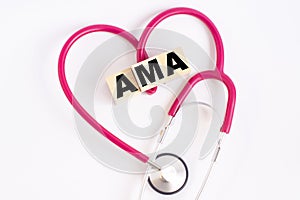 A heart made out of a stethoscope and wooden cubes with letters AMA American Medical Association photo