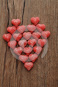 A heart made out of sugarcoated heart shape candy photo