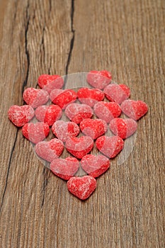 A heart made out of sugarcoated heart shape candy photo