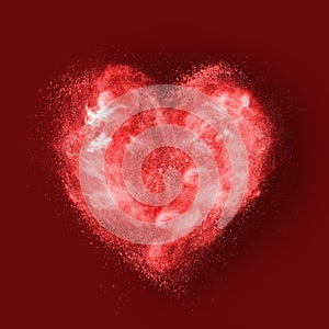 Heart made of powder explosion on red