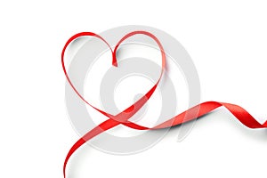 Heart made of red ribbon on white background, top view. Festive