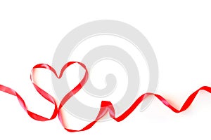 Heart made of red silk ribbon isolated on a white background. Valentine`s Day Concept, February 14th