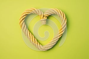 Heart made rope green background. Generate Ai