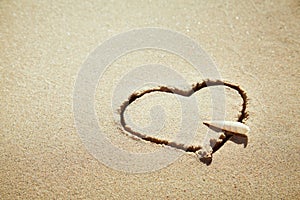 Heart made of sand on the beach. Love concept.