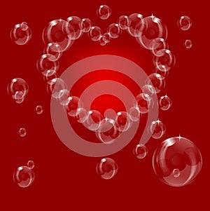 A heart made from soap bubbles on a red background