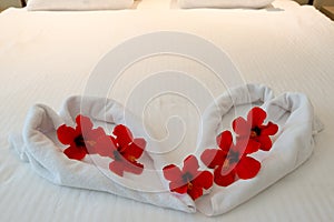 Heart made from towels on honeymoon bed