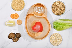 Heart model and Vitamin nutrition pills with fresh fruit and vegetable, Healthy diet, Vitamin and mineral supplement, Nutrition