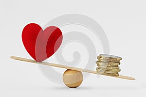Heart and money on balance scale - Concept of money priority in life photo