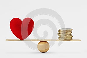 Heart and money on balance scale - Order of priority in life among love and money