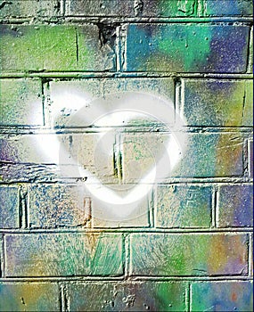 Heart on a multicoloured brick wall. Symbol of love. Graffiti.