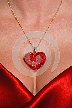 Heart necklace and red satin dress