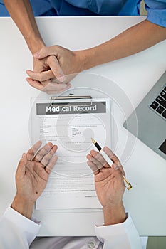 A heart patient visits a doctor for advice on health care and medication to treat heart disease symptoms after the medical team