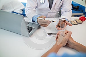 A heart patient visits a doctor for advice on health care and medication to treat heart disease symptoms after the medical team