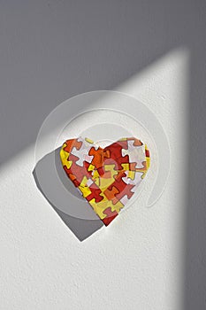 Heart patterned with puzzle pieces, for the autism