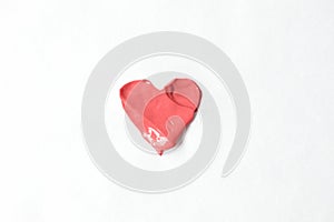 Heart from pink lipstick on white background. Cosmetic smear of liquid. Concept of Valentine`s Day in beauty