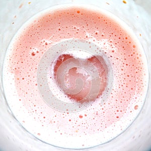 Heart on pink milkshake glass