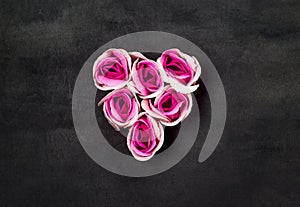 Heart of pink roses on black backgraund