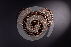 Heart in a ray of light on a dark background