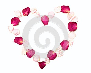 Heart of red and pink rose petals. Frame in shape of heart on white background. Romantic floral background template