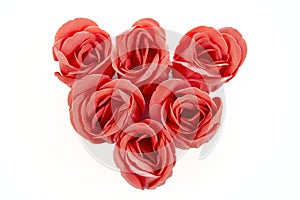 Heart of red roses from soap on a white