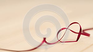 heart ribbon - red ribbon - valentines day decoration background with copy space - curly bended love ribbon