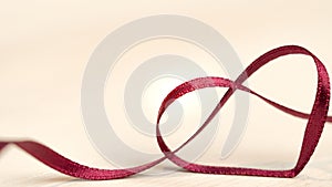 heart ribbon - red ribbon - valentines day decoration background with copy space - curly bended love ribbon