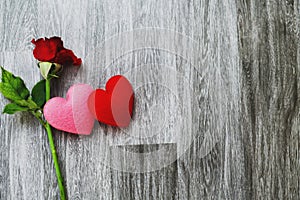 heart and rose flower pink and rose on wood background. concept valentine